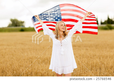 happy woman with american flag on cereal field happy woman with american flag on cereal field 25788546