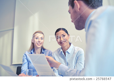 group of smiling businesspeople meeting in office 25788547