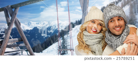 happy family couple in winter clothes hugging 25789251