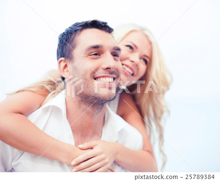 couple having fun on the beach couple having fun on the beach 25789384