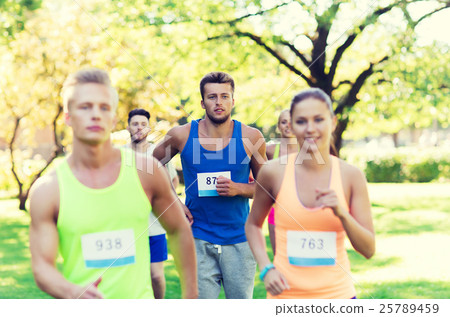 happ young sportsmen racing wit badge numbers 25789459