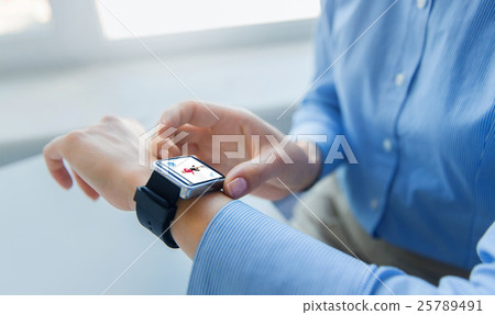 close up of hands with fitness app on smart watch close up of hands with fitness app on smart watch 25789491