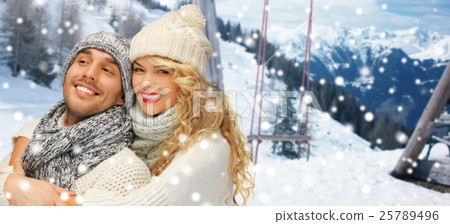 happy family couple in winter clothes hugging happy family couple in winter clothes hugging 25789496