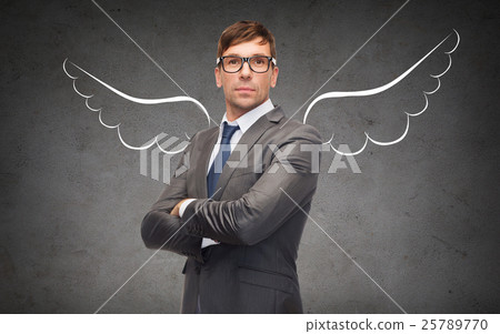 businessman with angel wings over gray 25789770