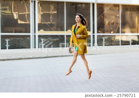 happy young woman or teenage girl on city street happy young woman or teenage girl on city street 25790721
