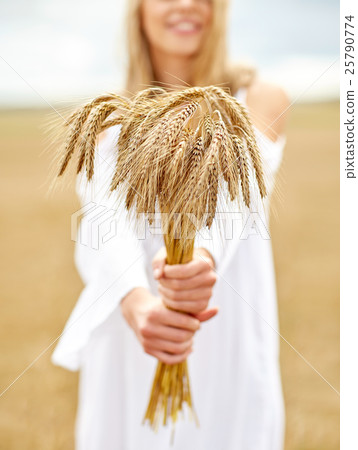 close up of happy woman with cereal spikelets 25790774