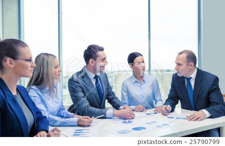 smiling business team at meeting smiling business team at meeting 25790799