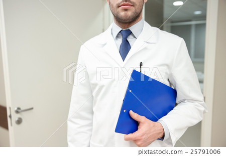 close up of doctor with clipboard at hospital close up of doctor with clipboard at hospital 25791006