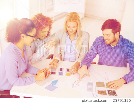 smiling creative team looking at sketch smiling creative team looking at sketch 25791330