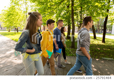 group of happy teenage students walking outdoors group of happy teenage students walking outdoors 25791464