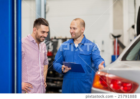 auto mechanic with clipboard and man at car shop 25791888