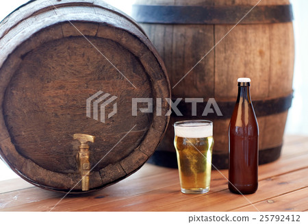 close up of old beer barrel, glass and bottle 25792412