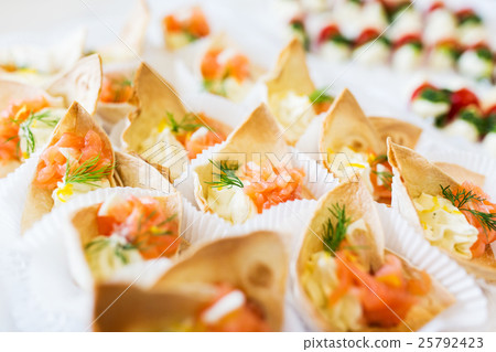 close up of dough cornet with salmon fish filling close up of dough cornet with salmon fish filling 25792423
