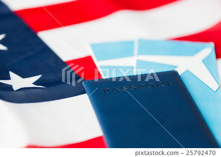 american flag, passport and air tickets american flag, passport and air tickets 25792470
