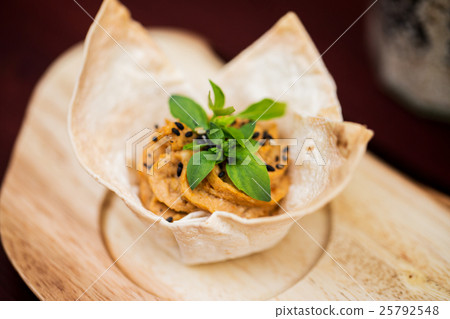 close up of dough cornet with filling 25792548