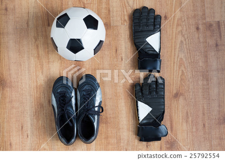 close up of soccer ball, boots and gloves close up of soccer ball, boots and gloves 25792554