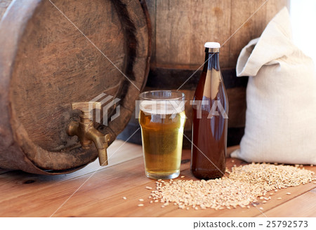close up of beer barrel, glass, bottle and malt 25792573