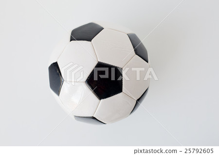 close up of football or soccer ball over white 25792605