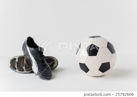 close up of soccer ball and football boots 25792606