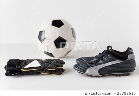 close up of goalkeeper gloves, ball, soccer boots 25792616