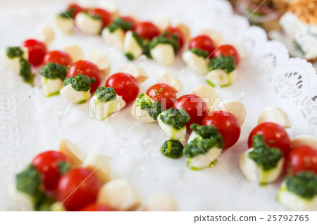 close up of mozzarella and cherry tomato canape close up of mozzarella and cherry tomato canape 25792765