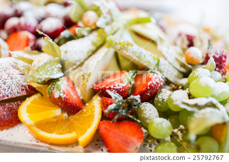 close up of dish with sugared fruit dessert close up of dish with sugared fruit dessert 25792767