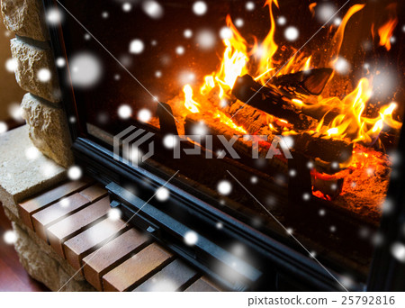 close up of burning fireplace with snow close up of burning fireplace with snow 25792816