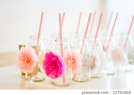 close up of glass bottles for drinks with straws close up of glass bottles for drinks with straws 25792869