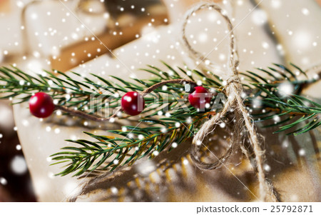 close up of christmas gift with fir brunch close up of christmas gift with fir brunch 25792871