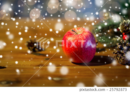 close up of apple with fir decoration on wood close up of apple with fir decoration on wood 25792873