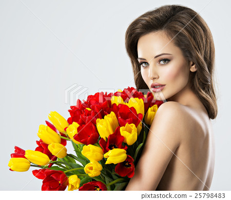 Nude Sexy young woman with flowers. 25798483