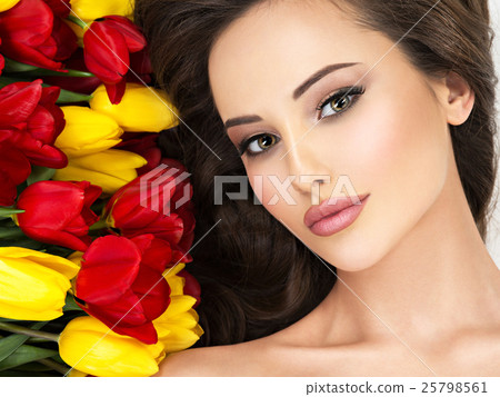 Closeup beauty face of the woman with flowers. Closeup beauty face of the woman with flowers. 25798561