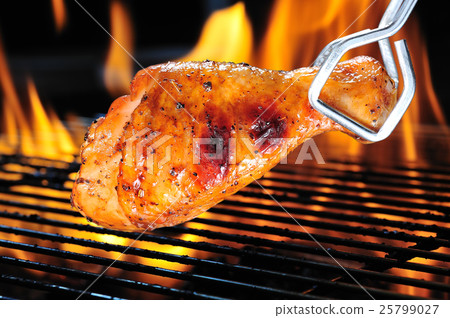 Grilled chicken leg on the flaming grill Grilled chicken leg on the flaming grill 25799027