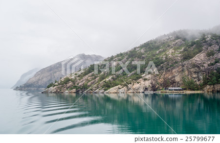 Norwegian fjord in fog and beautiful reflection on Norwegian fjord in fog and beautiful reflection on 25799677