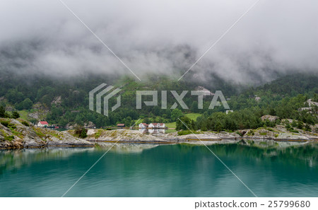 Houses of norwegian village at fjord's shores . Houses of norwegian village at fjord's shores . 25799680