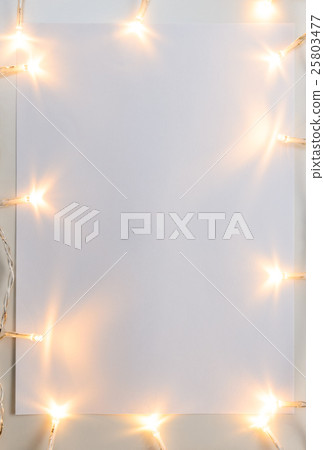 Christmas lights on gray table 25803477