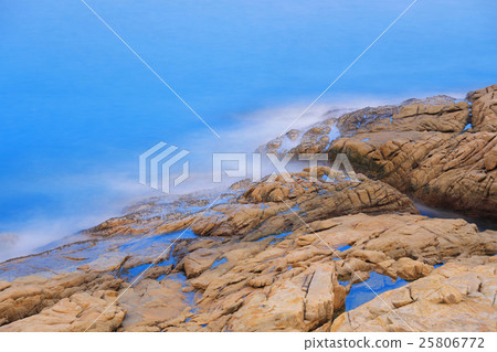 rocky sea coast and blurred water in shek o 25806772