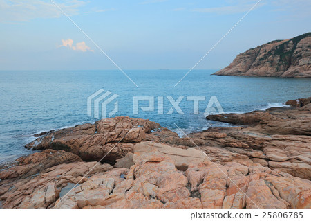 rocky sea coast and blurred water in shek o 25806785