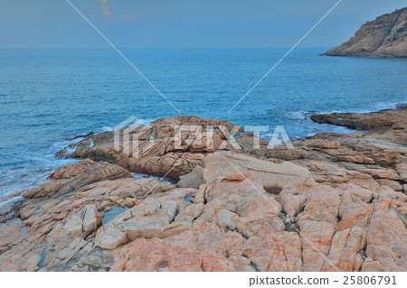 rocky sea coast and blurred water in shek o 25806791
