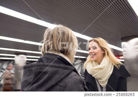Senior couple standing at the underground platform Senior couple standing at the underground platform 25808263