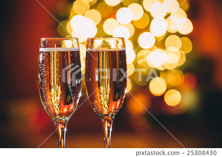 Beautiful two glasses of champagne standing  25808430