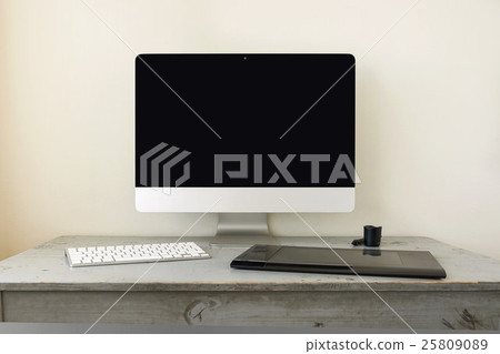 Computer with Keyboard and Graphic Tablet on Table 25809089