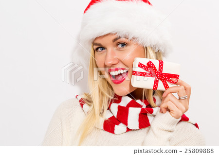 A woman holding a present A woman holding a present 25809888