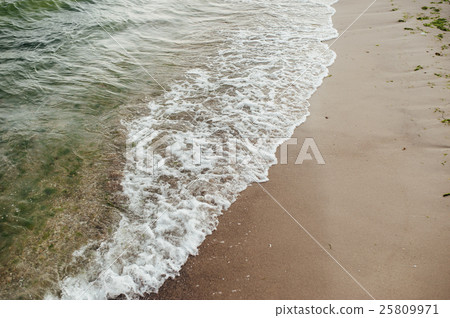 Soft wave of the sea on the sandy beach Soft wave of the sea on the sandy beach 25809971