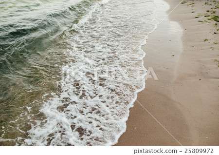 Soft wave of the sea on the sandy beach Soft wave of the sea on the sandy beach 25809972