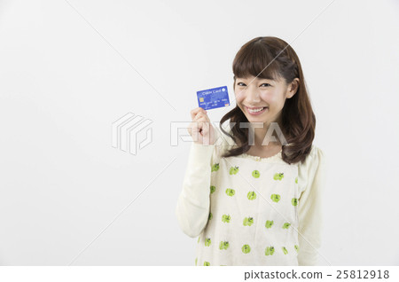 Housewife pointing to a credit card Housewife pointing to a credit card 25812918