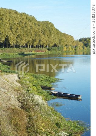 Small boat floating in the Vienne river France · Chinon city 25823378