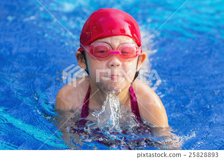 Child Swimming Breaststroke in Swimming Pool 25828893