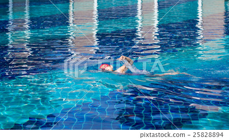 Child Swimming Freestyle in Swimming Pool Child Swimming Freestyle in Swimming Pool 25828894