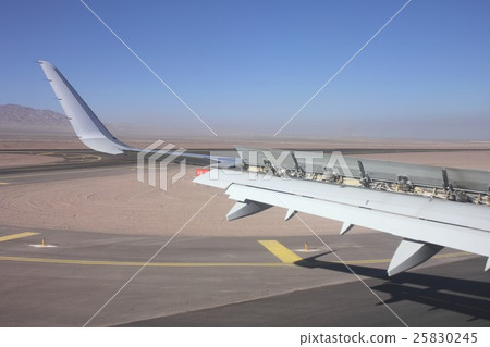 Spoiler opened to the back of the main wing of an airliner that landed at Calama Airport in South America Chile Spoiler opened to the back of the main wing of an airliner that landed at Calama Airport in South America Chile 25830245